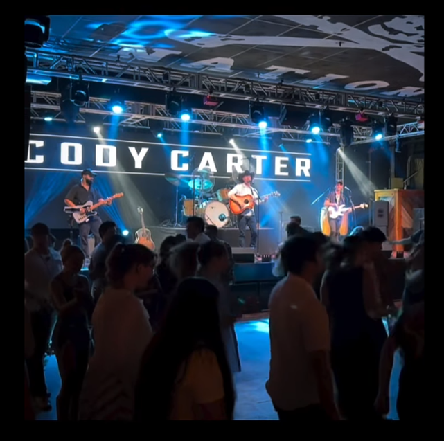 Crowd watching Cody Carter Band on the night stage